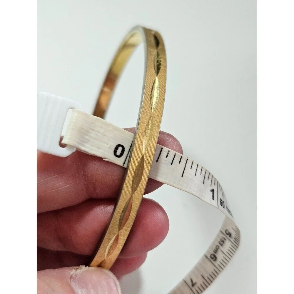 Monet gold tone diamond cut bangle bracelet 7.75